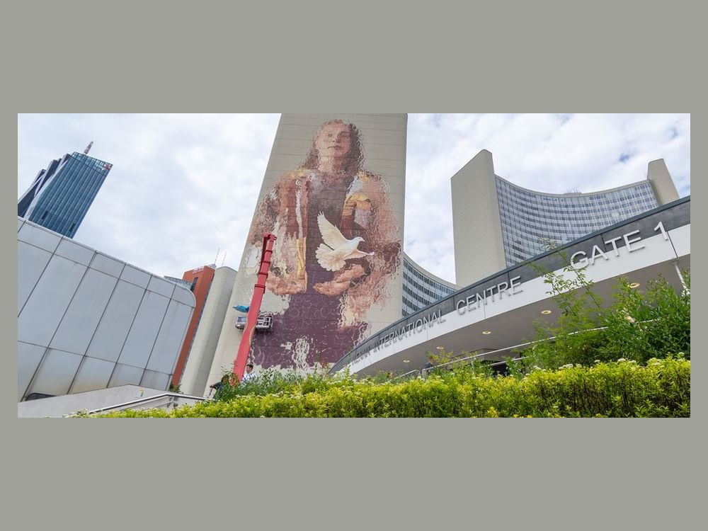 ‘Fragility of peace’ depicted in giant new mural on UN tower in Vienna