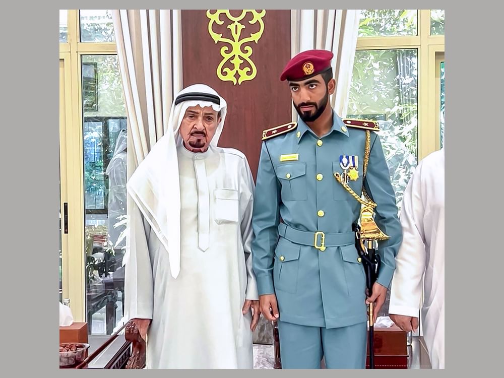 Humaid bin Rashid receives Officer Cadet Obaid Al Kaabi, winner of Sword of Honour from Police College