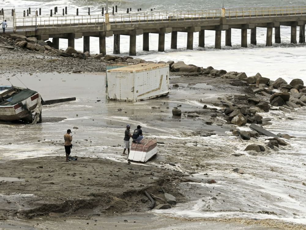 Peru’s Navy rescues dozens of fishermen stranded by giant waves