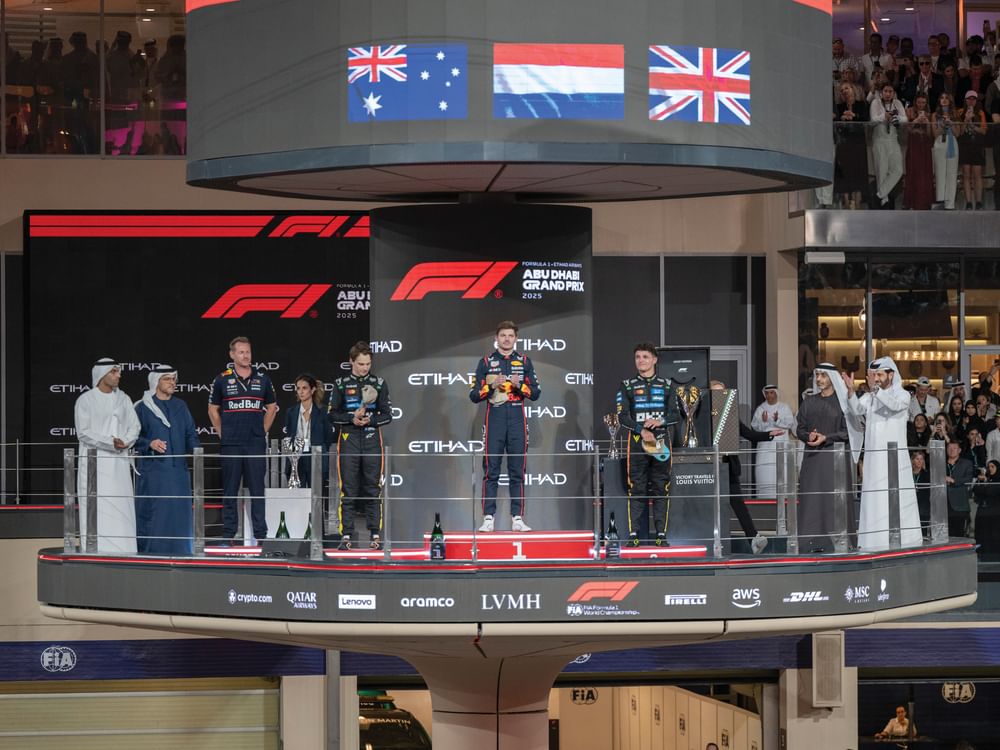 Theyab bin Zayed presents trophy to 17th Formula 1 Etihad Airways Abu Dhabi Grand Prix winner Lando Norris