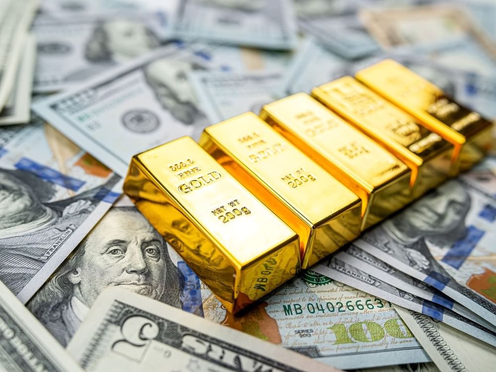 Gold prices drop on firmer dollar