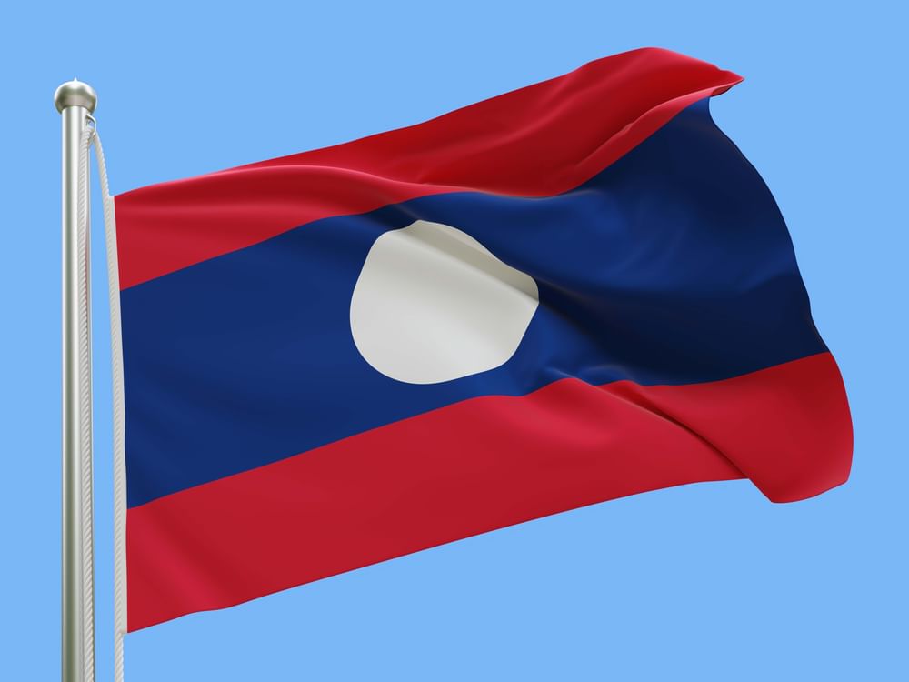Rescuers pull four from flooded cave in Laos, two still missing