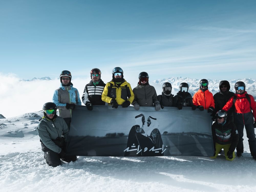 UAE flag, portrait of Zayed and Rashid unfurled atop Alps as part of Eid Al Etihad celebrations